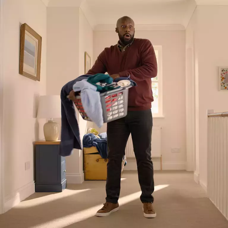 Man holding a washing basket