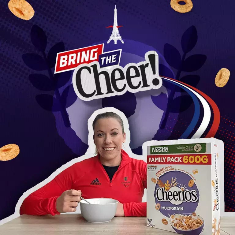Hannah Cockroft Paralympic Champion eating a bowl of Cheerios in front of a graphical background with Bring The Cheer logo