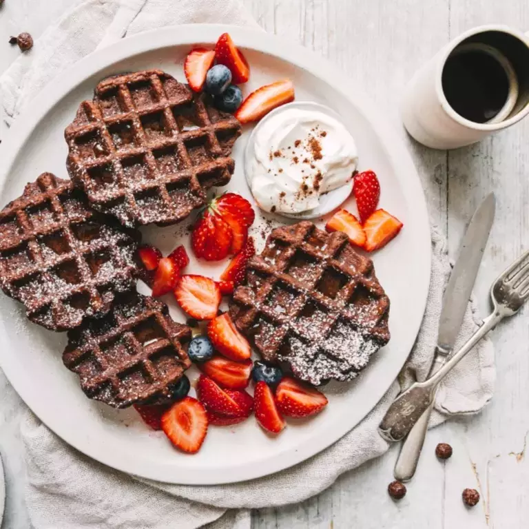 Chocolate waffles, berries and a coffee.