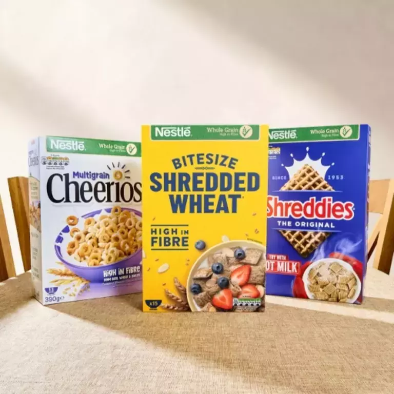 Cheerios, Shredded Wheat Bitesize and Shreddies packs on a table